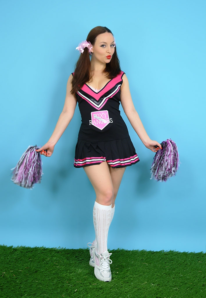 Brunette Cheerleader wearing White Long Socks, Sneakers and Black Short Dress